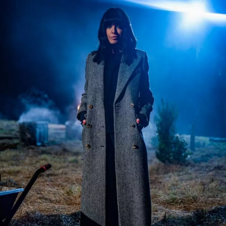 Claudia Winklman on the set of BBC's The Traitors wearing a Harris Tweed grey herringbone coat